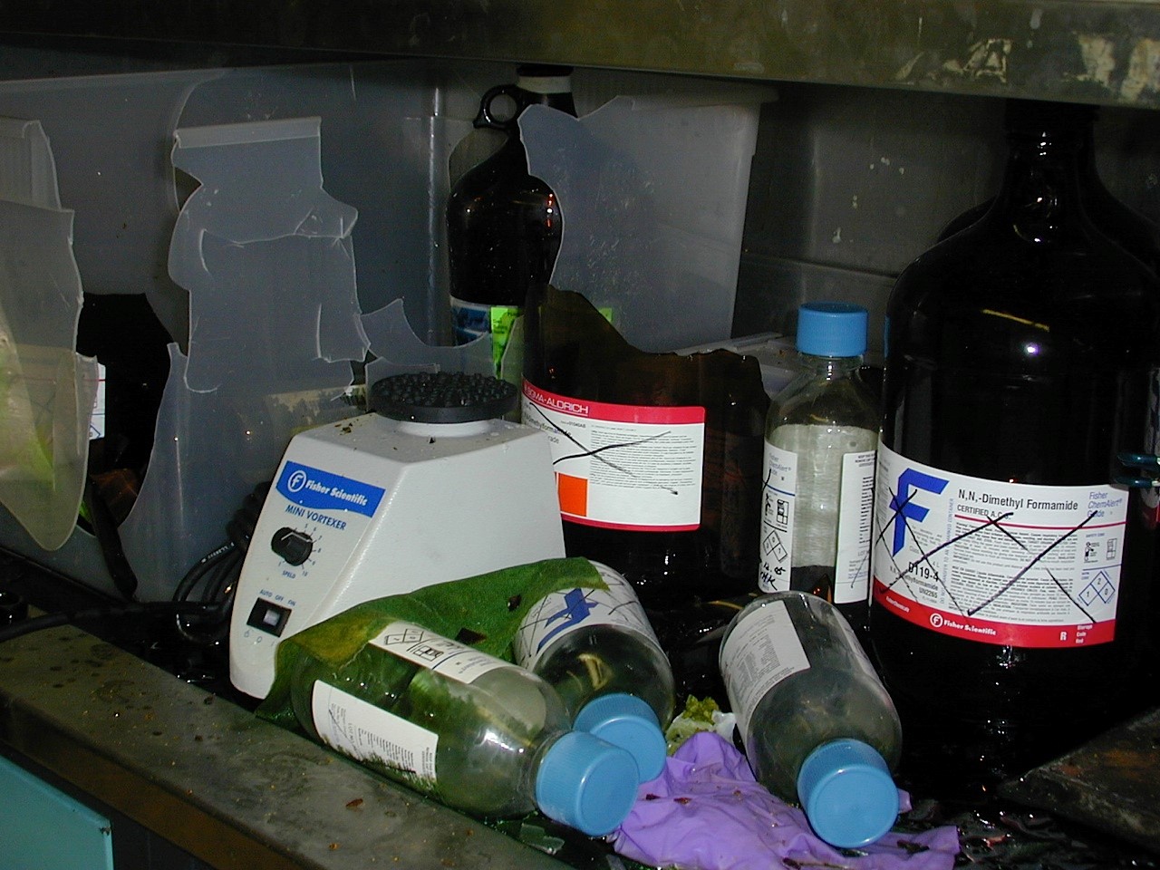 Aftermath of ruptured glass piranha bottle in fume hood