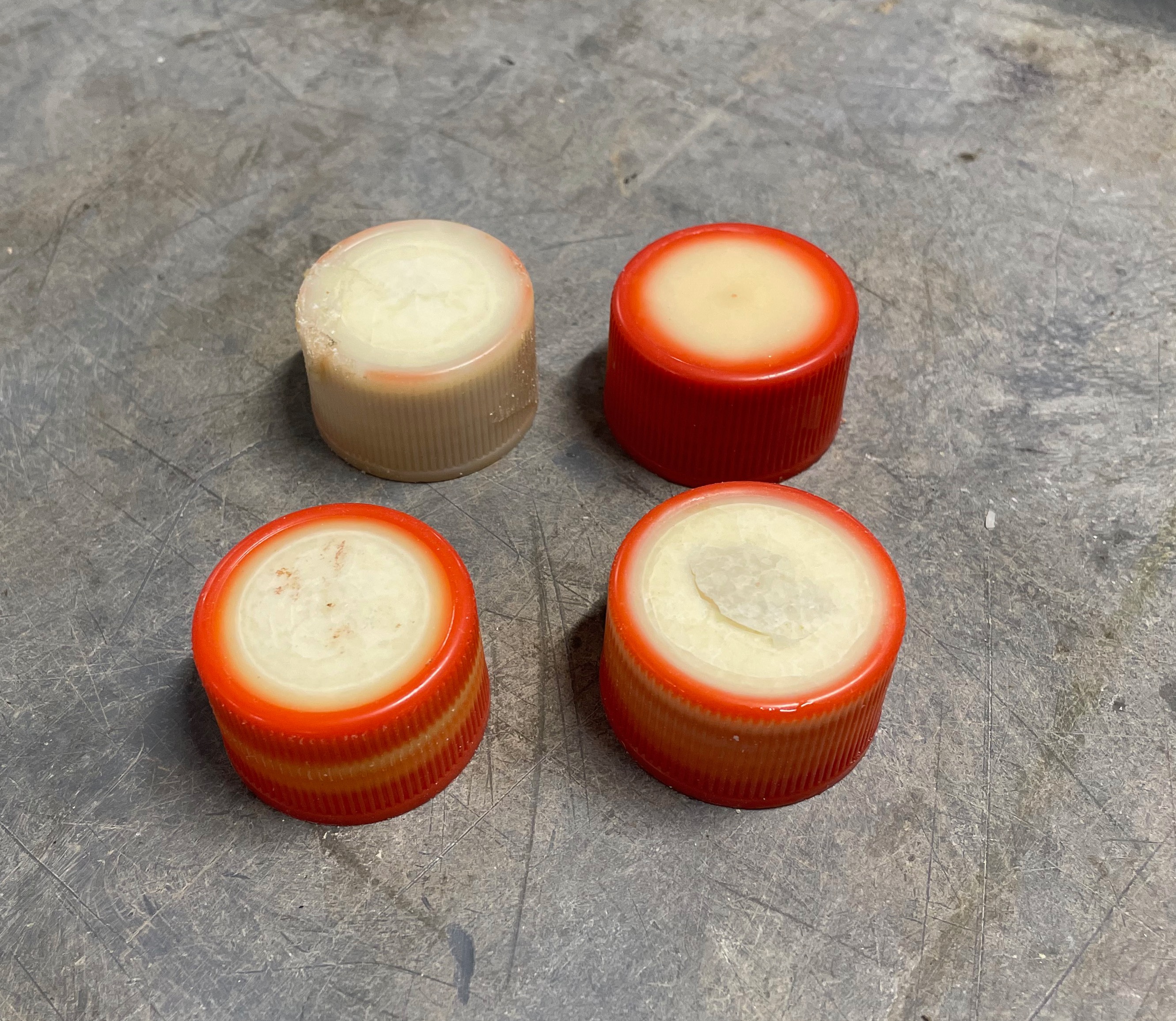 Damaged acid bottle caps